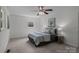 A cozy bedroom featuring a ceiling fan, natural light, and comfortable decor at 146 Duff St, Gastonia, NC 29715