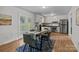 Dining area with table, chairs, rug, and view of backyard through patio doors at 146 Duff St, Gastonia, NC 29715
