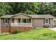 Home featuring a front porch with white railings, complimented by lush green lawn at 146 Duff St, Gastonia, NC 29715
