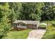 Inviting home with a quaint front porch, brick foundation, and a convenient carport at 146 Duff St, Gastonia, NC 29715