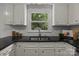 Updated kitchen featuring white cabinetry and a stainless steel sink at 146 Duff St, Gastonia, NC 29715