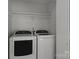 An organized laundry closet with a side-by-side washer and dryer at 146 Duff St, Gastonia, NC 29715