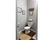Cozy half-bath with wood flooring and decorative wall hangings at 1818 Windy Willow Ln, Dallas, NC 28034