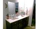 The bathroom features a dual sink vanity with dark cabinets and a large mirror, providing ample space at 1818 Windy Willow Ln, Dallas, NC 28034