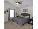 This is a neutral primary bedroom with a comfortable bed, ceiling fan, and window for natural light at 1818 Windy Willow Ln, Dallas, NC 28034