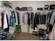 Walk-in closet is well organized with hanging clothes, shoe racks, and overhead storage for maximum utilization at 1818 Windy Willow Ln, Dallas, NC 28034