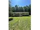 Ranch home featuring a small front porch, manicured lawn, and lush landscaping at 194 Wild Plum Ln, Blacksburg, SC 29702