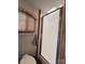 Comfortable bathroom with shower and window blinds for privacy at 207 Cardinal Dr, New London, NC 28127