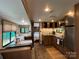 Cozy RV interior featuring a dining area, well-equipped kitchen, and a view into the bedroom at 207 Cardinal Dr, New London, NC 28127