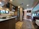 Compact RV kitchen with stainless steel appliances and wood cabinets at 207 Cardinal Dr, New London, NC 28127