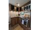 Well-equipped RV kitchen featuring stainless steel appliances, wood cabinets, and modern countertops at 207 Cardinal Dr, New London, NC 28127