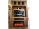 Cozy entertainment area with large TV and fireplace at 207 Cardinal Dr, New London, NC 28127