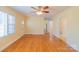 Well-lit living room featuring hardwood floors and a neutral color palette at 208 S Thompson St, Monroe, NC 28112