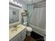 Full bathroom with a shower/tub combo and a single vanity and sink at 212 E Texas Ave, Bessemer City, NC 28016