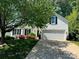 Charming two-story home with lush landscaping and a well-manicured lawn at 21218 Baltic Dr, Cornelius, NC 28031