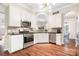Well-appointed kitchen featuring stainless steel appliances and stone backsplash at 21218 Baltic Dr, Cornelius, NC 28031