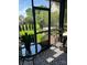 View of a well-decorated screened porch that overlooks a beautiful backyard at 21218 Baltic Dr, Cornelius, NC 28031