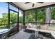 Relaxing screened porch with comfortable seating and views of the lush backyard at 21218 Baltic Dr, Cornelius, NC 28031