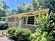 View of a quaint brick home's entry with a decorative door and covered porch at 2201 Airdale Rd, Lancaster, SC 29720