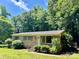 Inviting brick home featuring well-manicured landscaping, mature trees, and a welcoming facade at 2201 Airdale Rd, Lancaster, SC 29720