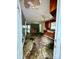 Damaged kitchen and hallway showcases peeling ceiling paint, aged cabinets and debris scattered on the floor at 2201 Airdale Rd, Lancaster, SC 29720