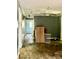 Overhead view of an unkempt room with peeling ceiling, outdated fan, and debris on the floor at 2201 Airdale Rd, Lancaster, SC 29720
