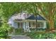 Charming home with a welcoming front porch, beautifully landscaped yard, and classic architectural details at 2223 Club Rd, Charlotte, NC 28205