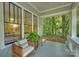 Close-up of a cozy front porch with seating, providing a relaxing outdoor space at 2223 Club Rd, Charlotte, NC 28205