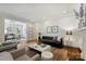 Stylish living room with hardwood floors and an open layout connecting to the dining area at 2223 Club Rd, Charlotte, NC 28205