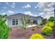 A charming backyard with a patio, surrounded by lush landscaping and manicured shrubbery at 2261 Lincolnshire Ln, Waxhaw, NC 28173