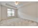 Bedroom features large window with natural light, and neutral carpet at 2261 Lincolnshire Ln, Waxhaw, NC 28173