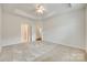 Spacious bedroom featuring a tray ceiling, neutral color palette, and carpet flooring at 2261 Lincolnshire Ln, Waxhaw, NC 28173