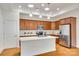 Modern kitchen with a central island, stainless appliances and stylish wood cabinetry at 2261 Lincolnshire Ln, Waxhaw, NC 28173