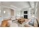 Bright living room with fireplace, built-in shelving, and elegant decor perfect for entertaining at 2261 Lincolnshire Ln, Waxhaw, NC 28173