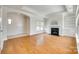 Spacious living room featuring hardwood floors, fireplace and a neutral color palette at 2261 Lincolnshire Ln, Waxhaw, NC 28173
