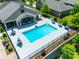 An aerial shot of a large community pool surrounded by seating and lush landscaping at 2261 Lincolnshire Ln, Waxhaw, NC 28173