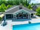 An aerial view of a refreshing community pool with plenty of lounge chairs and seating at 2261 Lincolnshire Ln, Waxhaw, NC 28173