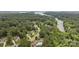 Beautiful aerial shot showcasing a neighborhood near lake featuring tree-lined streets and wooded homesites at 274 Cove Creek Loop, Mooresville, NC 28117