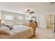 Comfortable bedroom featuring large windows, ceiling fan, and ample closet space at 274 Cove Creek Loop, Mooresville, NC 28117
