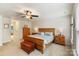 Spacious bedroom with a ceiling fan, natural lighting, and access to an ensuite bathroom at 274 Cove Creek Loop, Mooresville, NC 28117