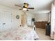 Bright bedroom with patterned bedding, a ceiling fan, and a connected sitting area at 274 Cove Creek Loop, Mooresville, NC 28117