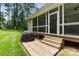 Outdoor deck featuring a grill and easy access to the screened porch, perfect for outdoor cooking and entertaining at 274 Cove Creek Loop, Mooresville, NC 28117