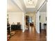 Inviting foyer with hardwood floors, elegant trim, and a glimpse of the living area at 274 Cove Creek Loop, Mooresville, NC 28117
