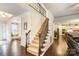 Grand foyer showcasing elegant staircase, hardwood floors, and inviting living spaces at 274 Cove Creek Loop, Mooresville, NC 28117