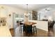 Kitchen area with a view of the backyard patio and open to the living room at 274 Cove Creek Loop, Mooresville, NC 28117