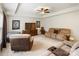 Inviting living room featuring cozy seating arrangements, a large flat-screen TV, and a tray ceiling with fan for comfort at 274 Cove Creek Loop, Mooresville, NC 28117