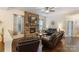 Living room features stone fireplace, hardwood floors, ceiling fan and comfortable seating at 274 Cove Creek Loop, Mooresville, NC 28117