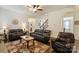 Spacious living room with hardwood floors, ceiling fan, and comfortable seating arrangement at 274 Cove Creek Loop, Mooresville, NC 28117