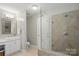 Modern bathroom featuring a glass enclosed shower, vanity with a sink, and tiled floors at 3112 Planters Ridge Rd, Charlotte, NC 28270