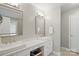 Dual vanity bathroom featuring a quartz countertop, modern fixtures, and vanity with a dedicated makeup space at 3112 Planters Ridge Rd, Charlotte, NC 28270